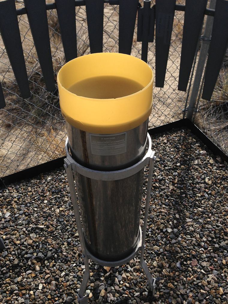 The rain gauge by the machine shed